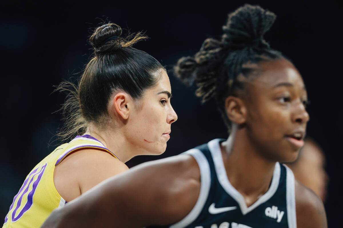 Los Angeles Sparks guard Kelsey Plum (10) eyes Aces guard Jewell Loyd during a WNBA basketball ...