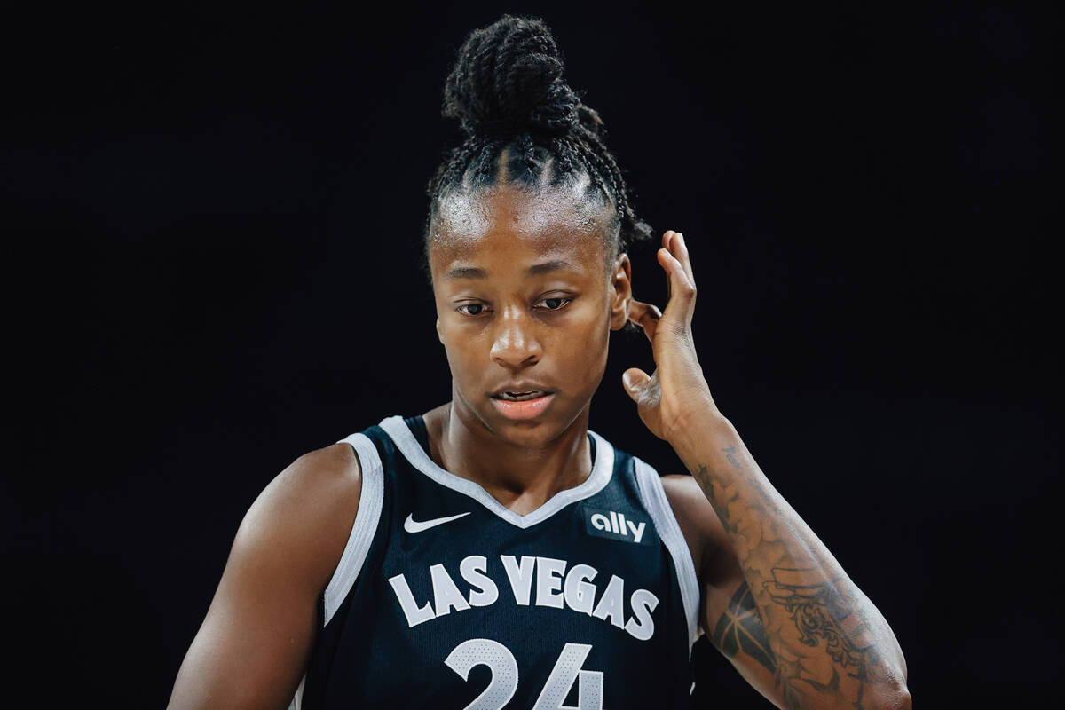 Aces guard Jewell Loyd (24) walks back down the court during a WNBA basketball game between the ...