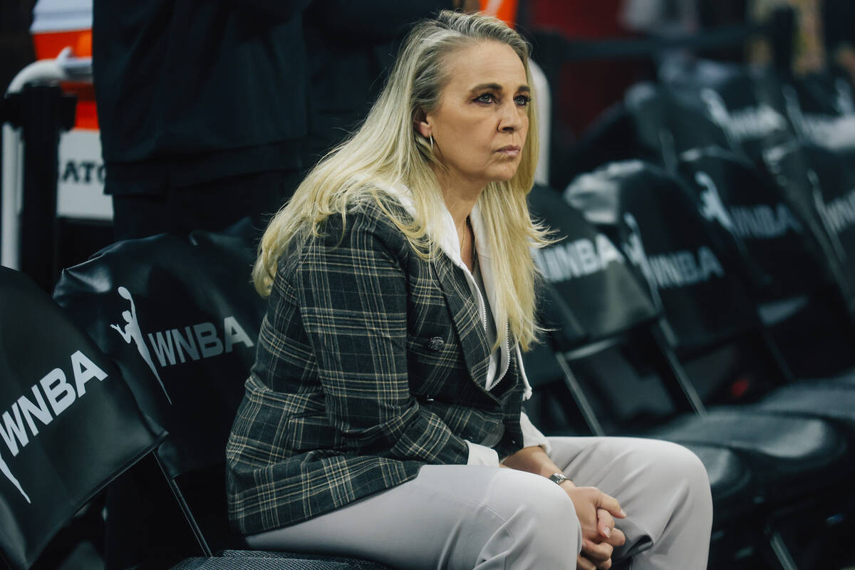 Aces head coach Becky Hammon sits during player intros during a WNBA basketball game between th ...