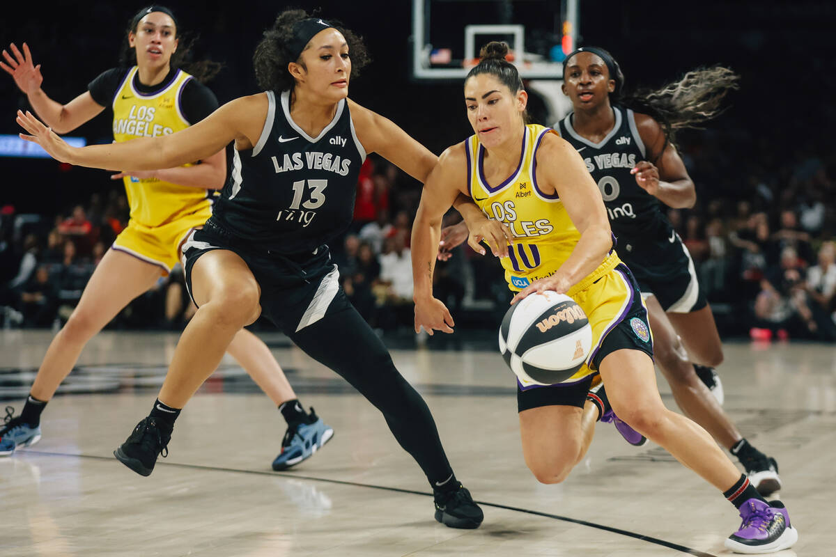 Aces guard Aaliyah Nye (13) guards Los Angeles Sparks guard Kelsey Plum (10) during a WNBA bask ...