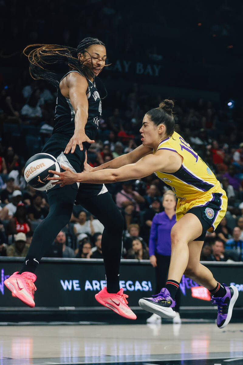 Aces center Kiah Stokes (41) jumps up to defends Los Angeles Sparks guard Kelsey Plum (10) as s ...