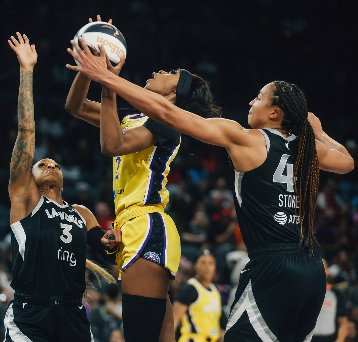 Los Angeles Sparks forward Rickea Jackson (2) attempts a shot as Aces players defend her during ...
