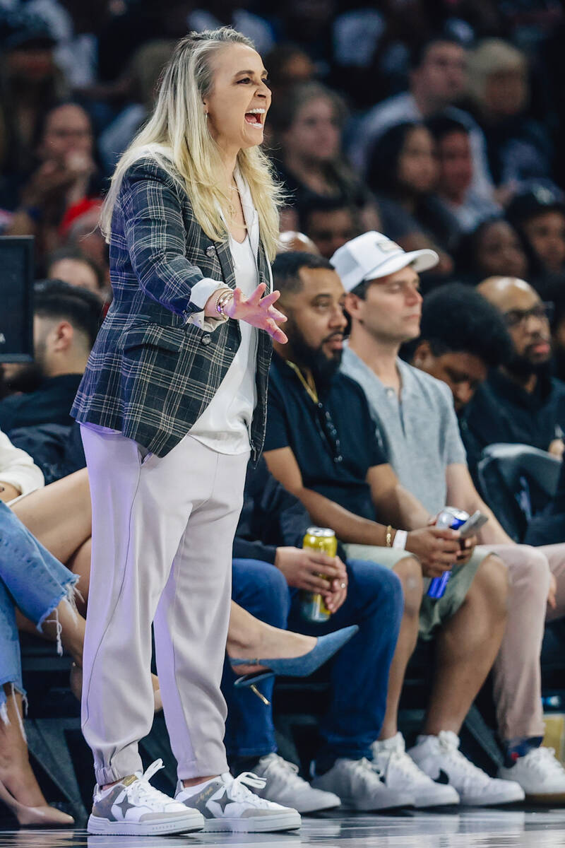 Aces head coach Becky Hammon coaches from the sidelines during a WNBA basketball game between t ...