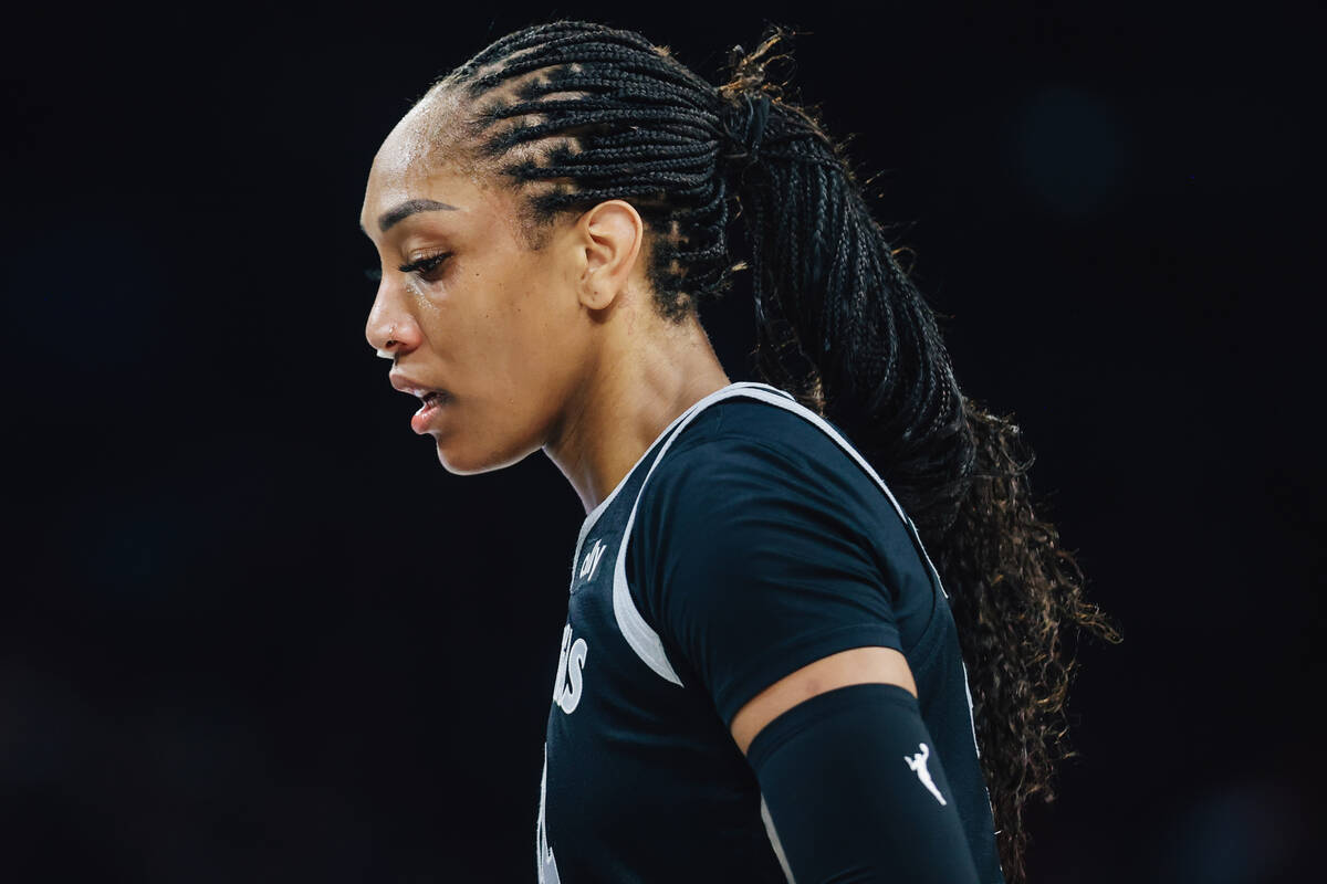 Aces center A'ja Wilson looks down during a WNBA basketball game between the Aces and Los Angel ...
