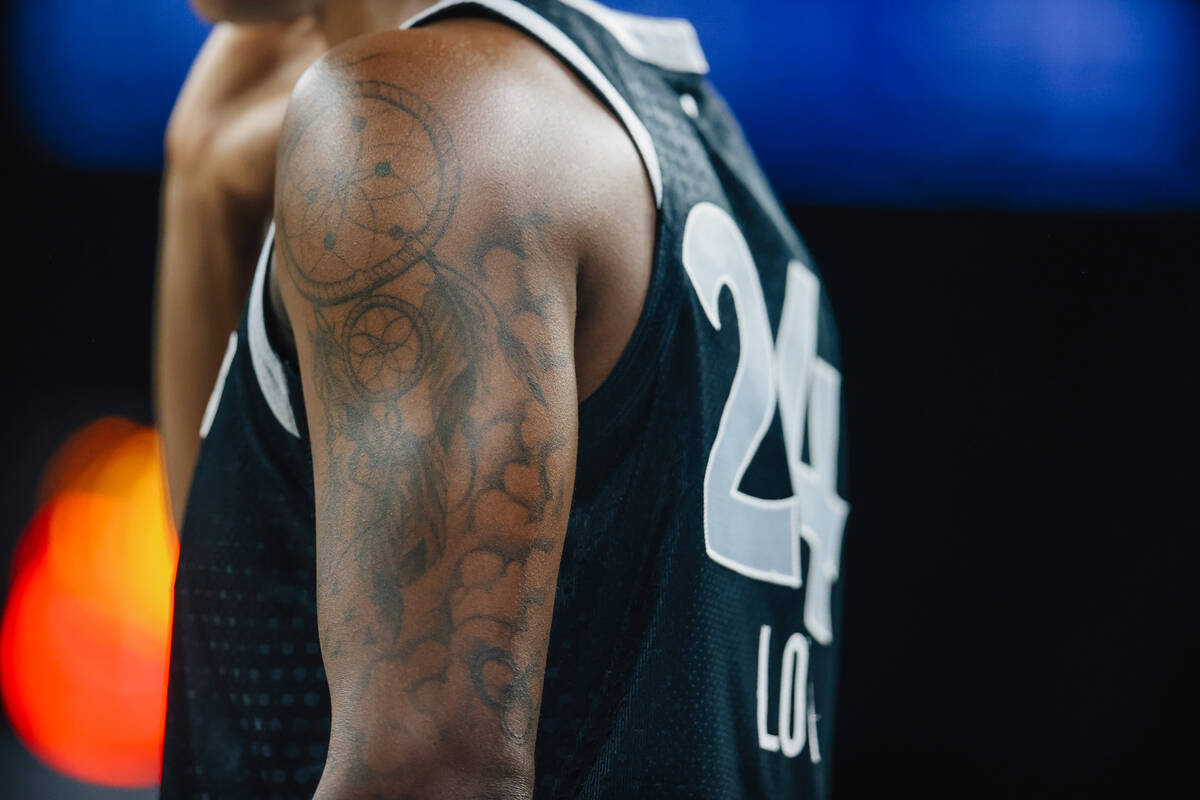 Aces guard Jewell Loyd’s tattoos are seen during a WNBA basketball game between the Aces ...