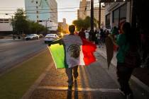People participate in a protest against ICE on Wednesday, June 11, 2025, in downtown Las Vegas. ...