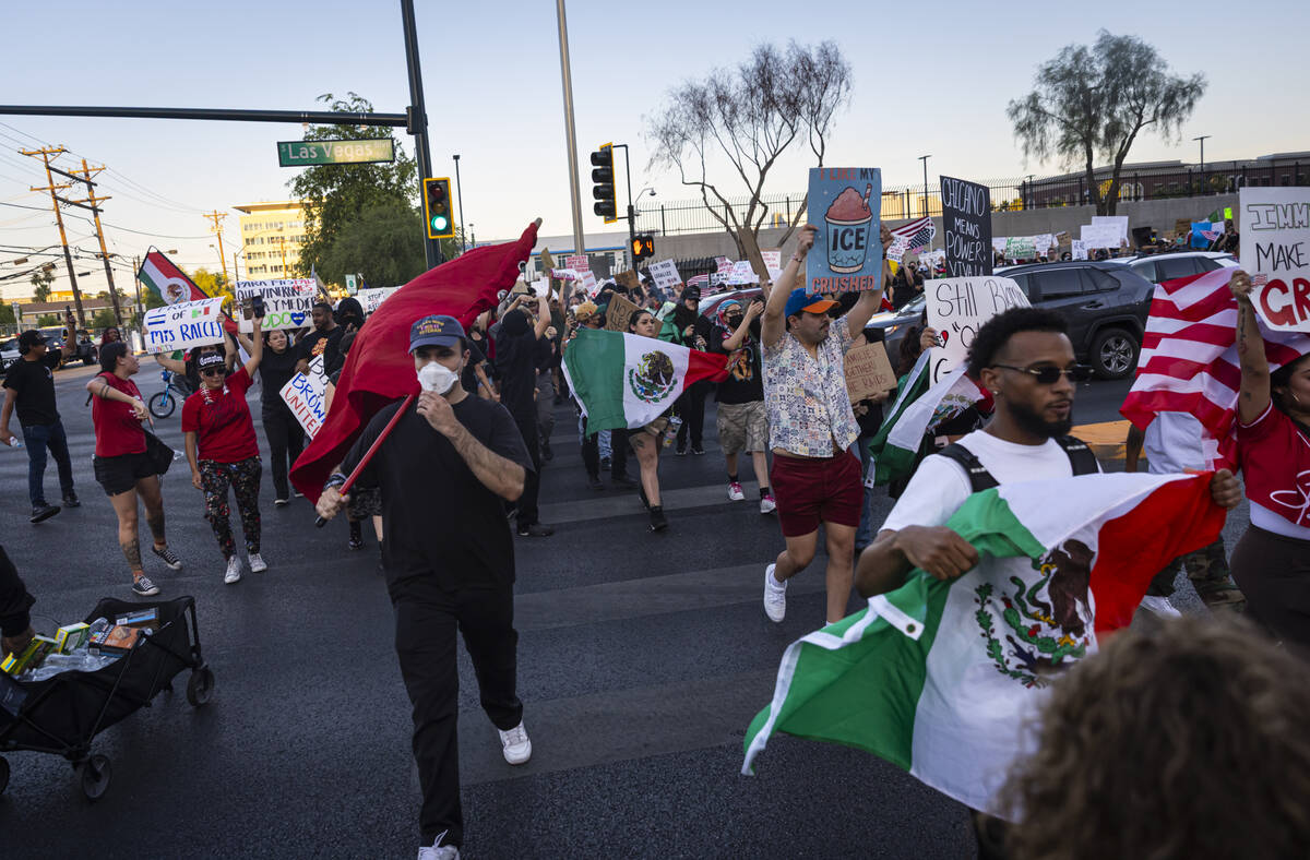People participate in a protest against ICE on Wednesday, June 11, 2025, in downtown Las Vegas. ...