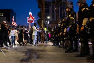 Protesters face off against Las Vegas police during a protest against ICE on Wednesday, June 11 ...