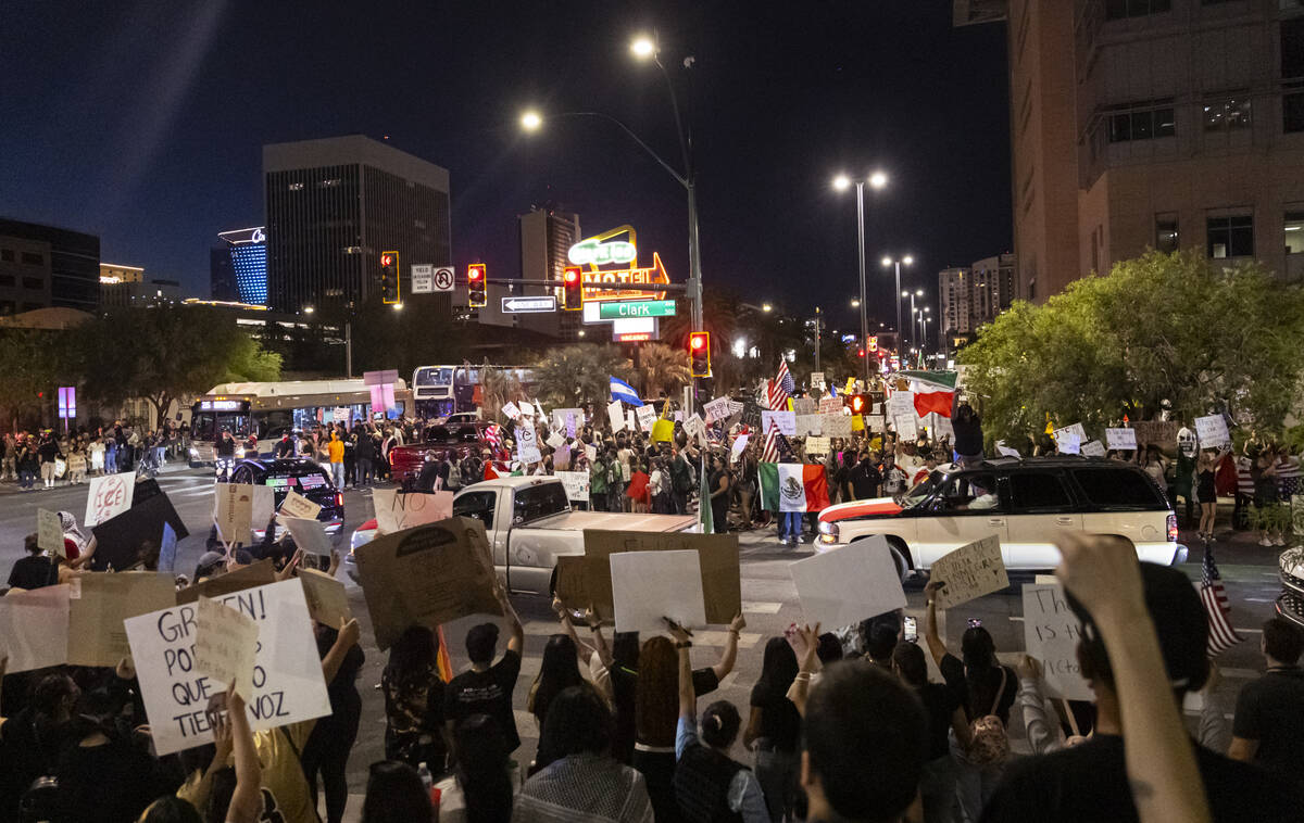 People participate in a protest against ICE on Wednesday, June 11, 2025, in downtown Las Vegas. ...