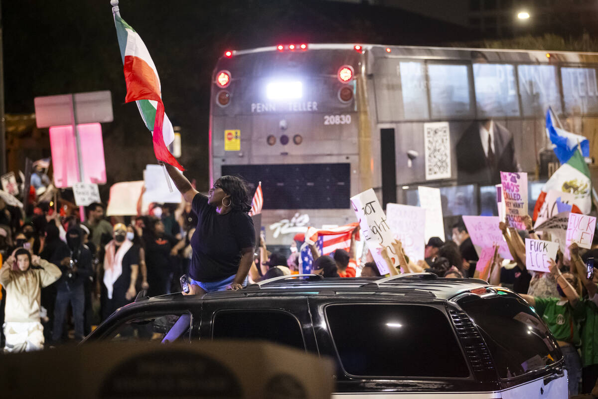 People participate in a protest against ICE on Wednesday, June 11, 2025, in downtown Las Vegas. ...