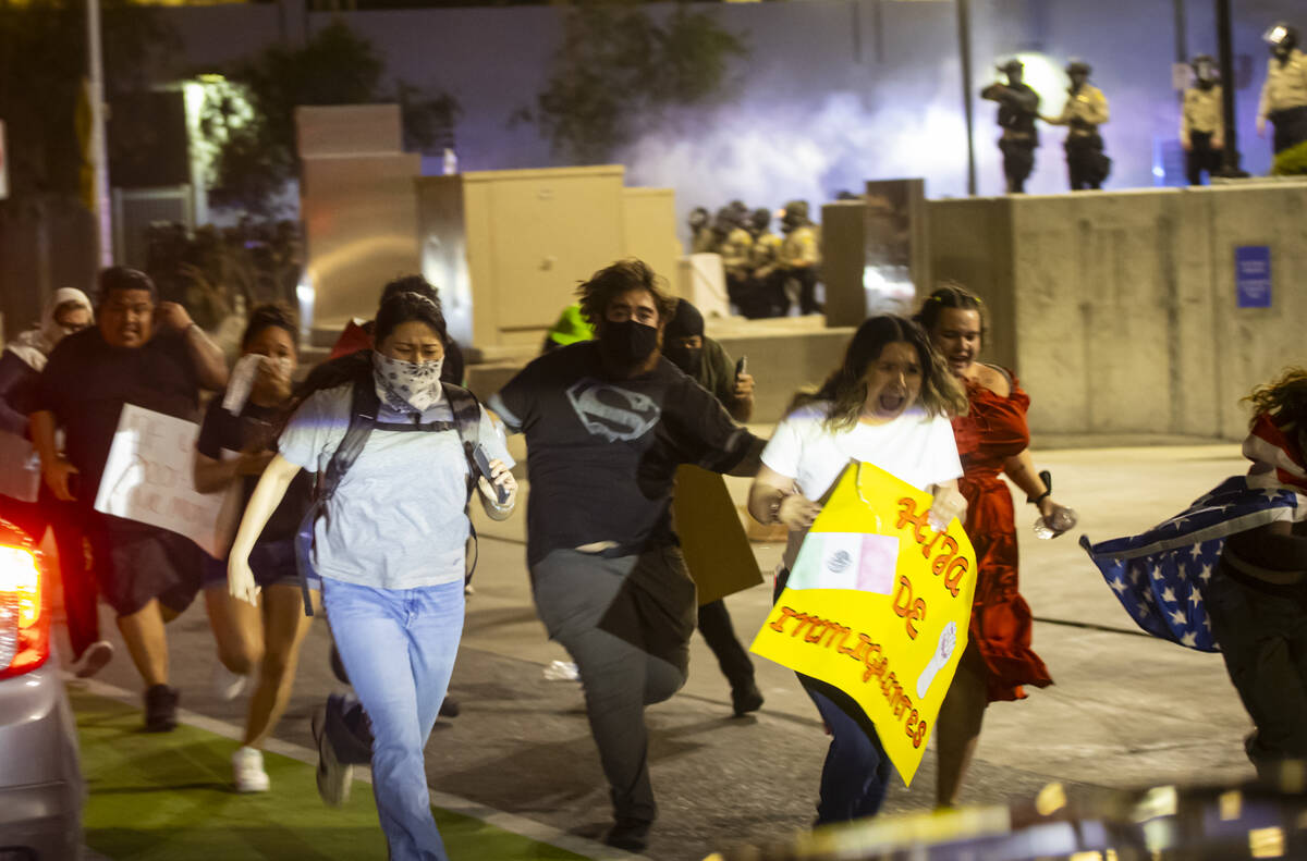People protesting against ICE run away as Las Vegas police deploy teargas and fire less lethal ...
