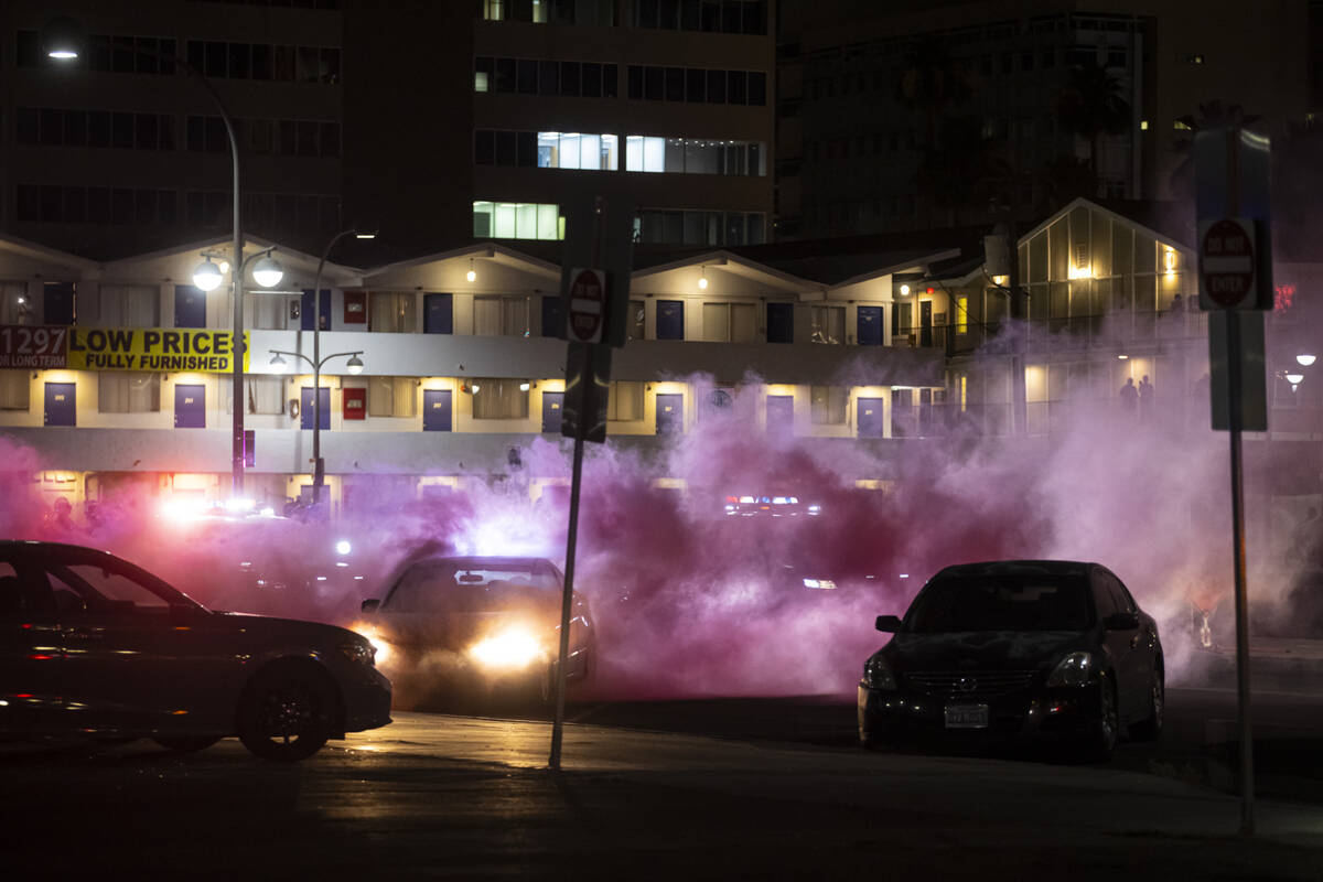 Cars in traffic are caught in teargas near Fremont East on Wednesday, June 11, 2025, in downtow ...