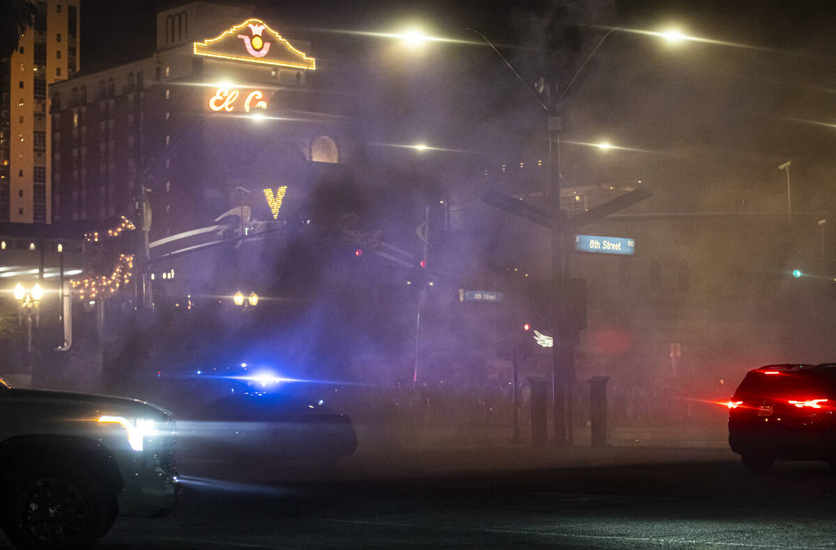Teargas fills the air on Fremont East after police dispersed a nonviolent crowd on Wednesday, J ...
