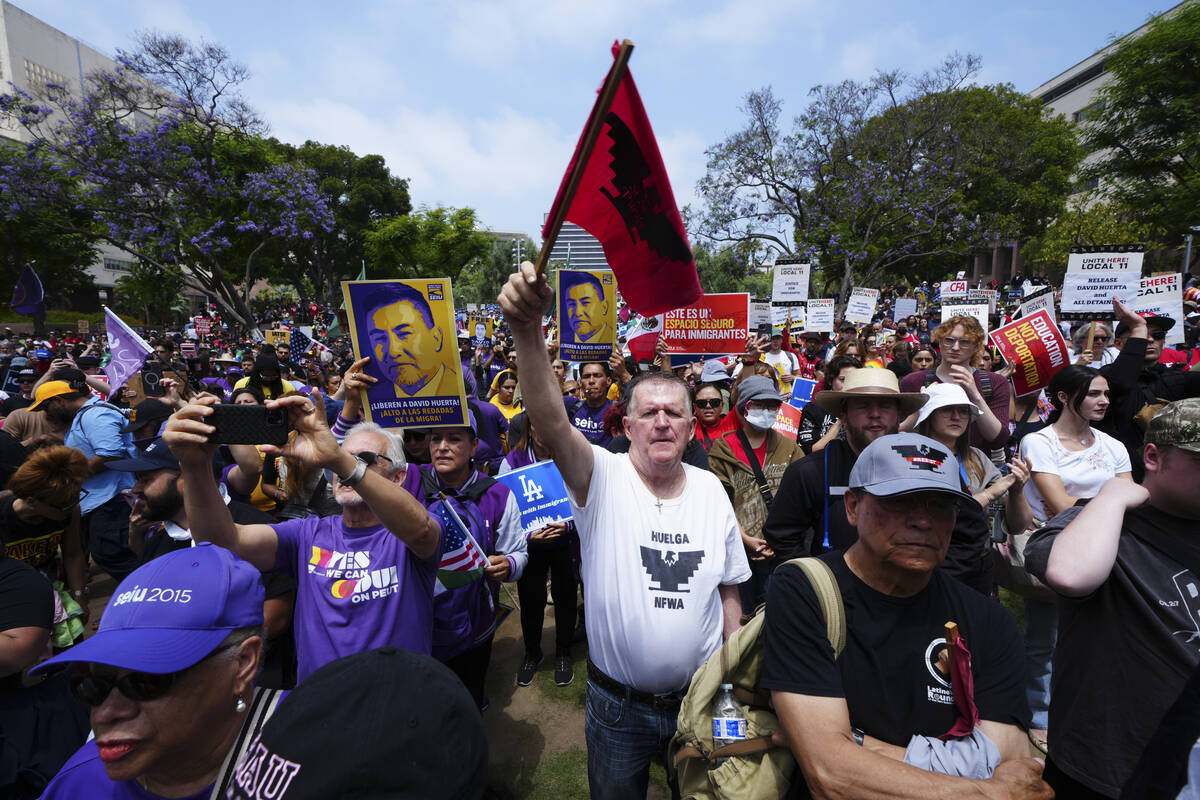 Supporters gather as civil rights legend Dolores Huerta, 95, speaks at a rally in Los Angeles, ...