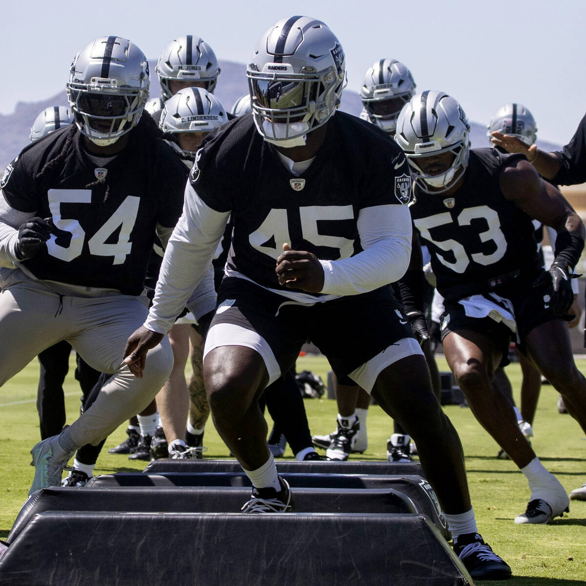 Raiders linebacker Devin White (45) runs through a drill during an NFL football mandatory minic ...