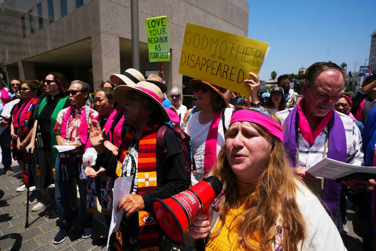 Protesters gather to denounce ICE, U.S Immigration and Customs Enforcement, operations Tuesday, ...