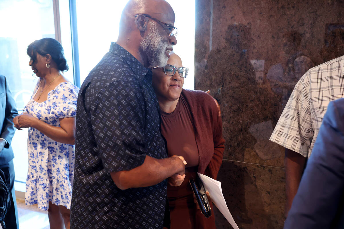 State Sen. Dina Neal, D-North Las Vegas, hugs North Las Vegas Planning Commission Chairman Alfo ...