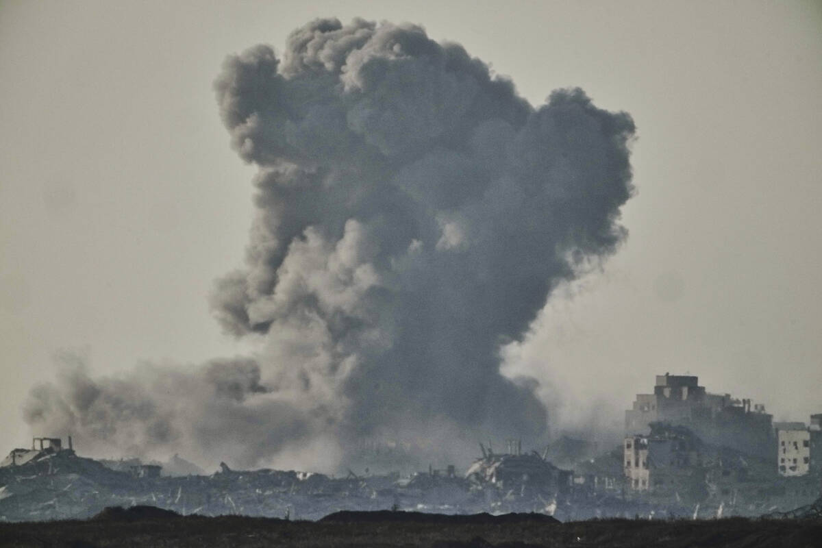 Smoke rises to the sky following an Israeli strike in the Gaza Strip as seen from southern Isra ...