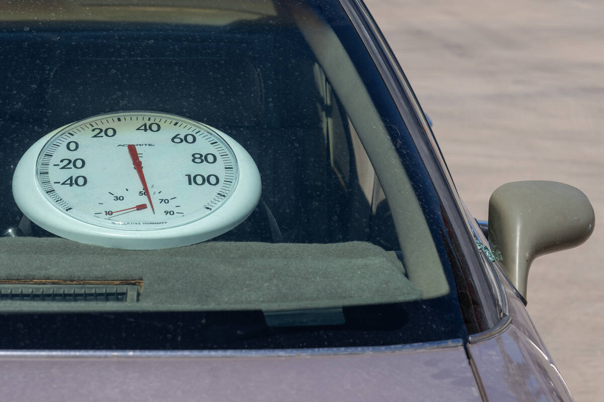 A thermometer rerads 148.6 degrees during a reenactment of a 911 response to a child left in a ...