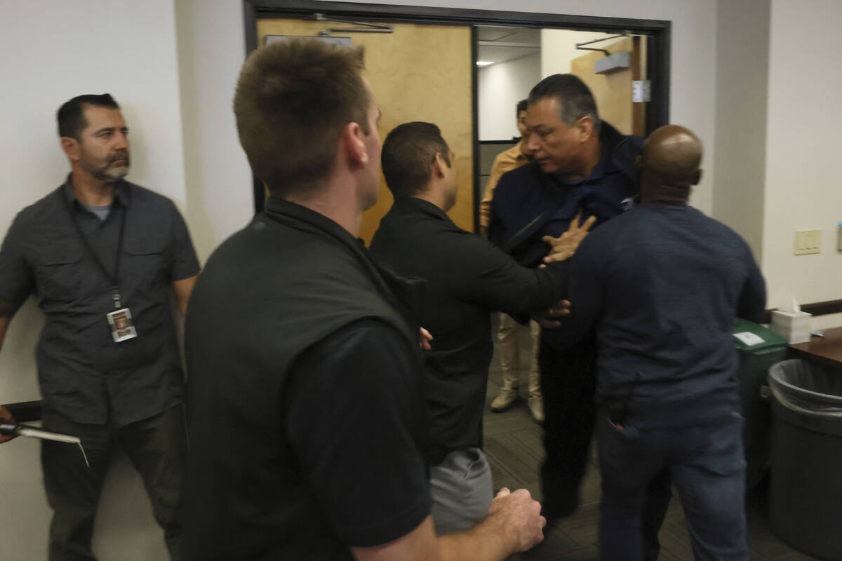 U.S. Sen. Alex Padilla, D-Calif., is pushed out of the room as Homeland Security Secretary Kris ...
