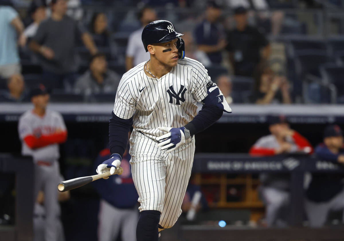 New York Yankees' Aaron Judge reacts after hitting a home run during the ninth inning of a base ...