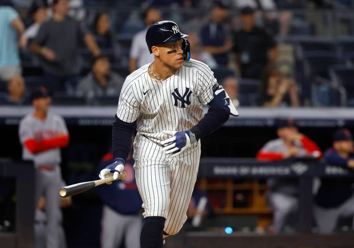 New York Yankees' Aaron Judge reacts after hitting a home run during the ninth inning of a base ...