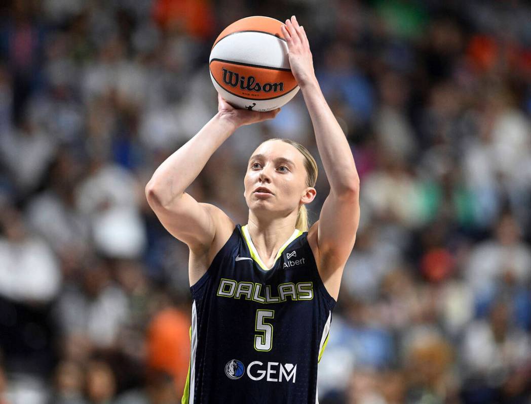 Dallas Wing's Paige Bueckers takes an outside shot on basket during a WNBA basketball game agai ...