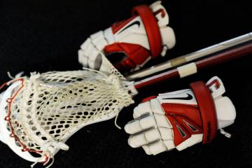 A Nike lacrosse glove is shown during an NCAA Division I semifinal lacrosse game on Saturday, M ...