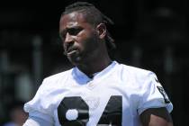 Raiders wide receiver Antonio Brown (84) stretches on the sideline during mandatory minicamp at ...