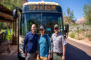 Alex Wiest (center) is celebrated as the Zion Canyon Shuttle System's 100 millionth rider (NPS ...