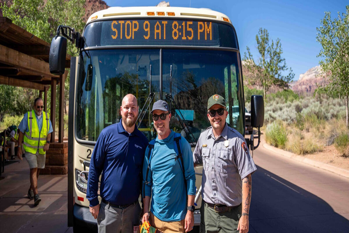 Alex Wiest (center) is celebrated as the Zion Canyon Shuttle System's 100 millionth rider (NPS ...