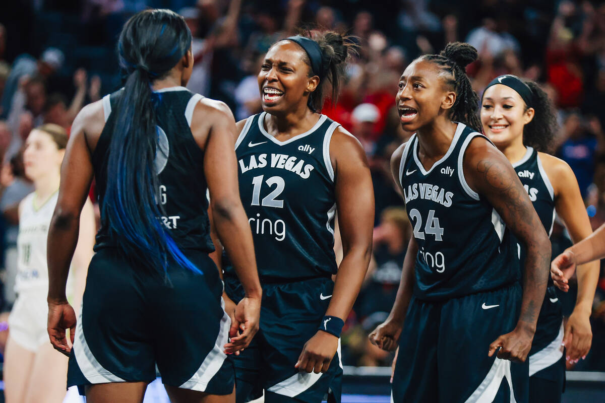 Las Vegas Aces guard Chelsea Gray (12) celebrates during a WNBA basketball game between the Ace ...