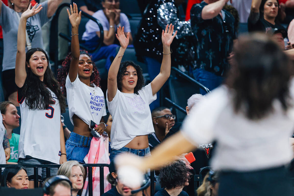 WNBA fans cheer for a free shirt during a WNBA basketball game between the Aces and Dallas Wing ...