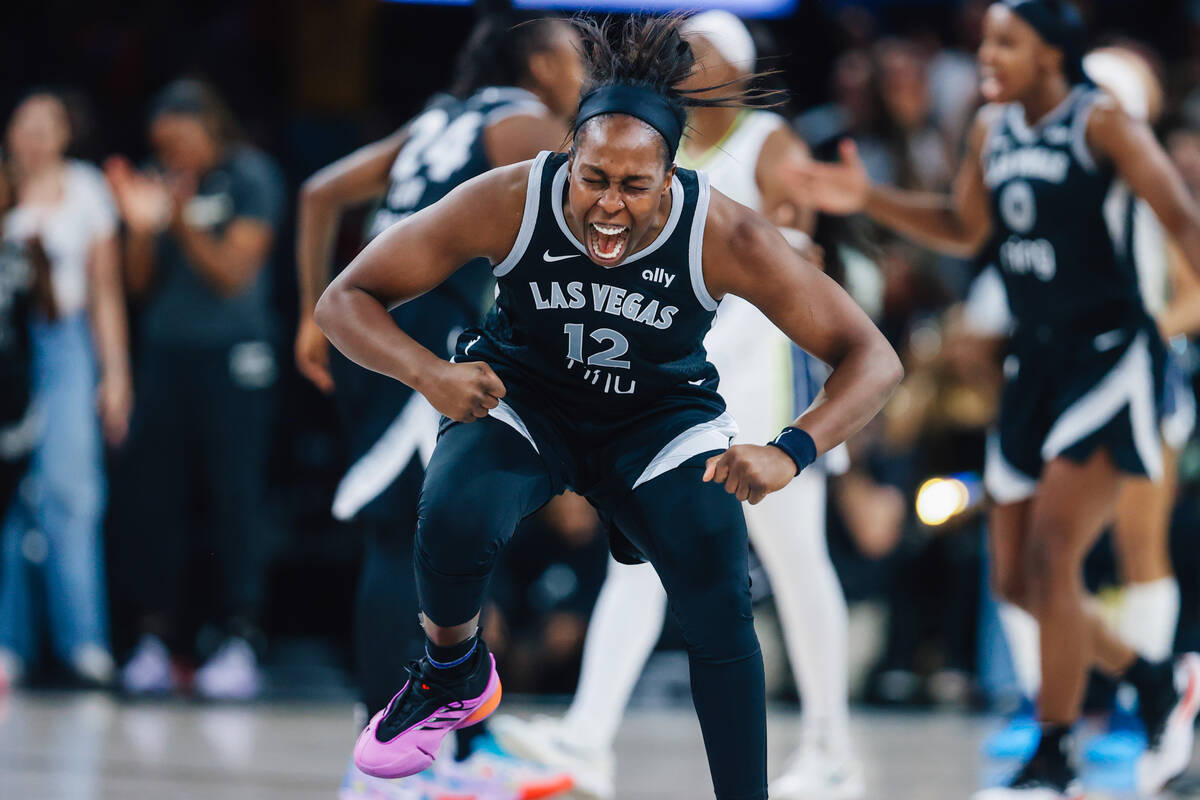 Las Vegas Aces guard Chelsea Gray (12) celebrates during a WNBA basketball game between the Ace ...
