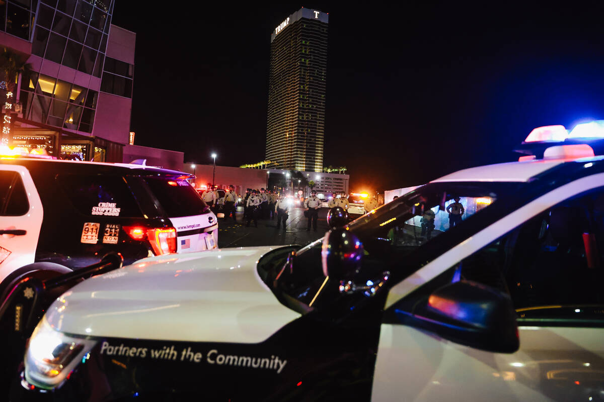 Police guard the way to the Trump International Hotel during a national “No Kings&#x201 ...