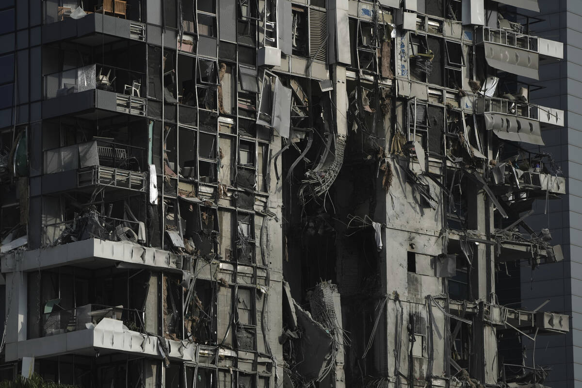 A residential building that was struck by a missile fired from Iran, is seen in Tel Aviv, Israe ...