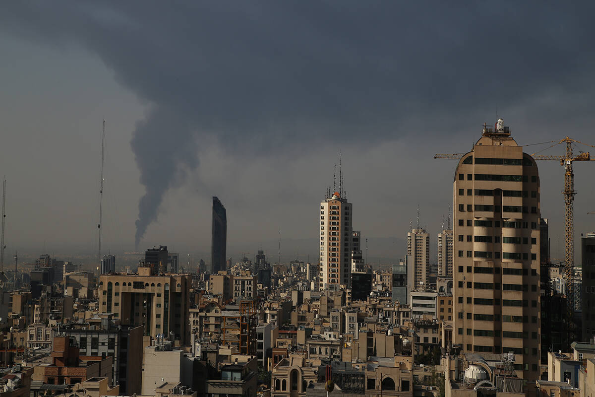 Huge smoke rises up from an oil facility facility after it appeared to have been hit by an Isra ...