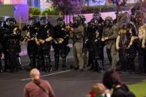 Las Vegas police prepare to fire tear gas and less lethal projectiles at people protesting agai ...