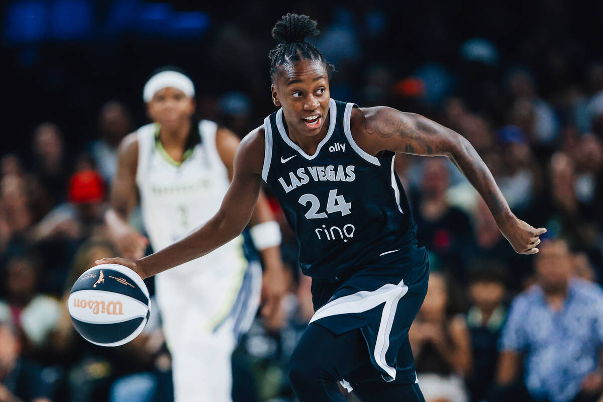 Las Vegas Aces guard Jewell Loyd dribbles the ball during a WNBA basketball game between the Ac ...