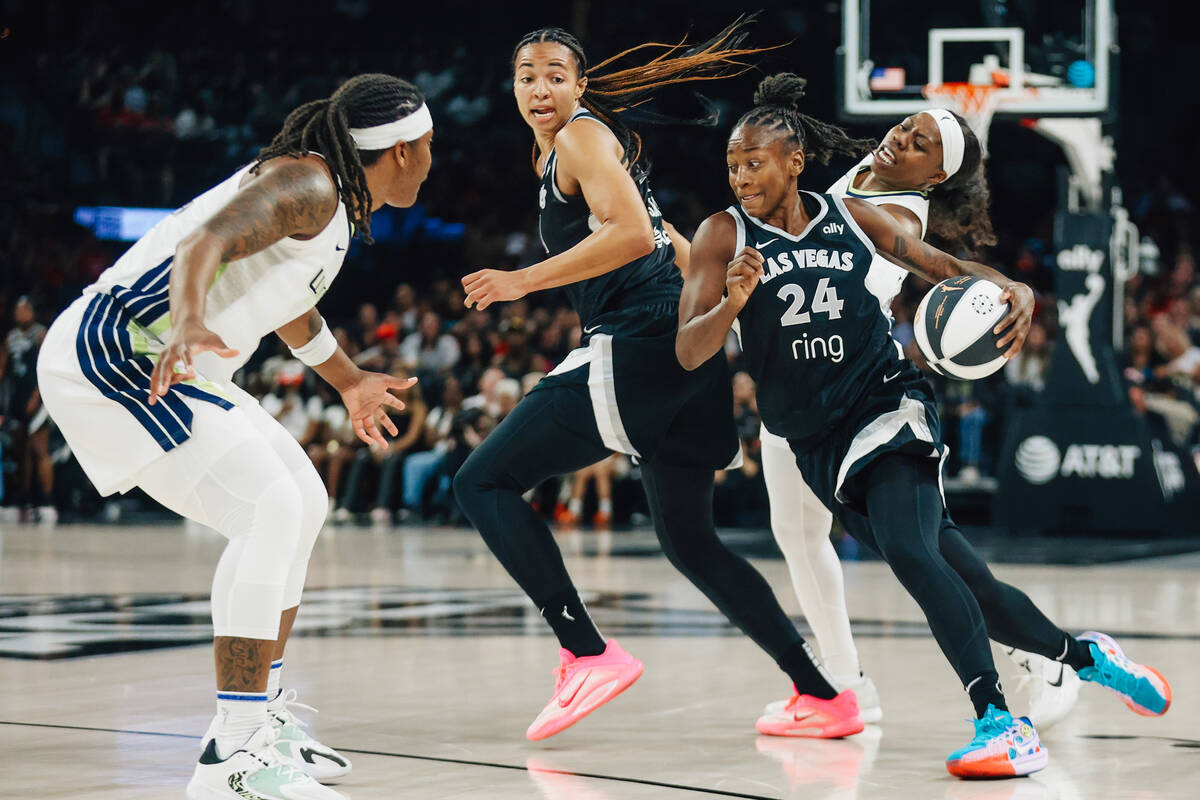 Las Vegas Aces guard Jewell Loyd (24) rushes past Dallas Wings defense during a WNBA basketball ...