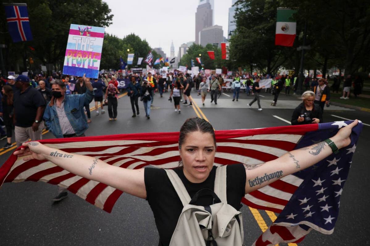 Demonstrators march down Benjamin Franklin Parkway during the "No Kings" protest, Sat ...