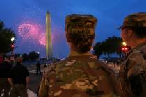 U.S. Army 2nd Lt. Hayle Mayer, left, and Corporal Addison Merrell, watch fireworks at the Washi ...