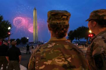 U.S. Army 2nd Lt. Hayle Mayer, left, and Corporal Addison Merrell, watch fireworks at the Washi ...