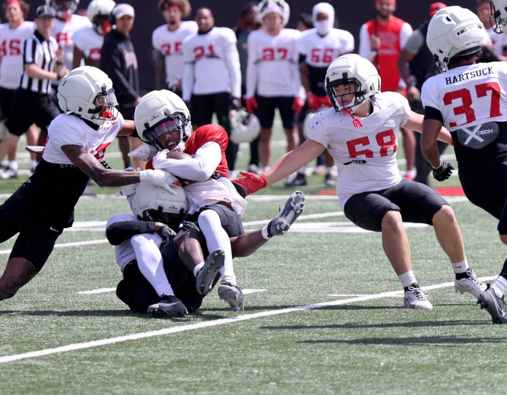 UNLV players scrimmage at Bill 'Wildcat' Morris Rebel Park in Las Vegas Friday, April 18, 2025. ...