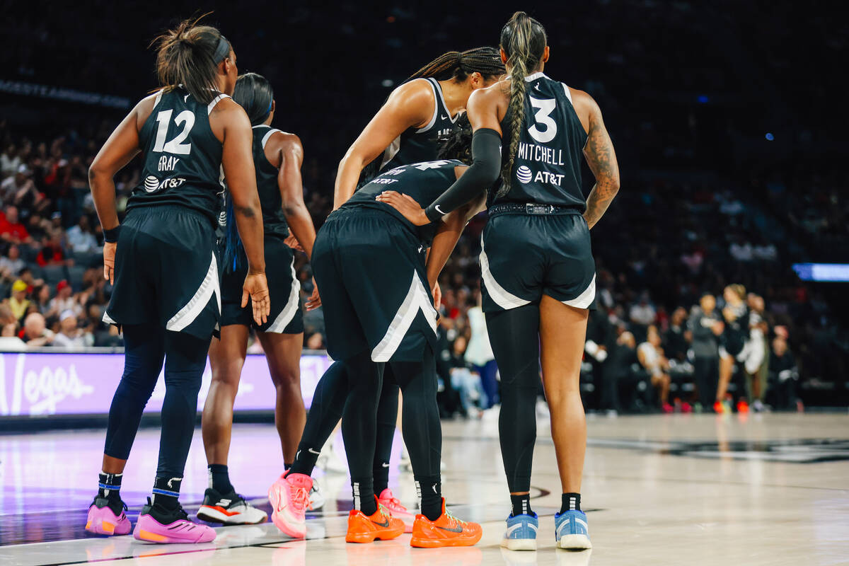 Aces guard Jewell Loyd (24) gets checked on by her teammates during a WNBA basketball game betw ...