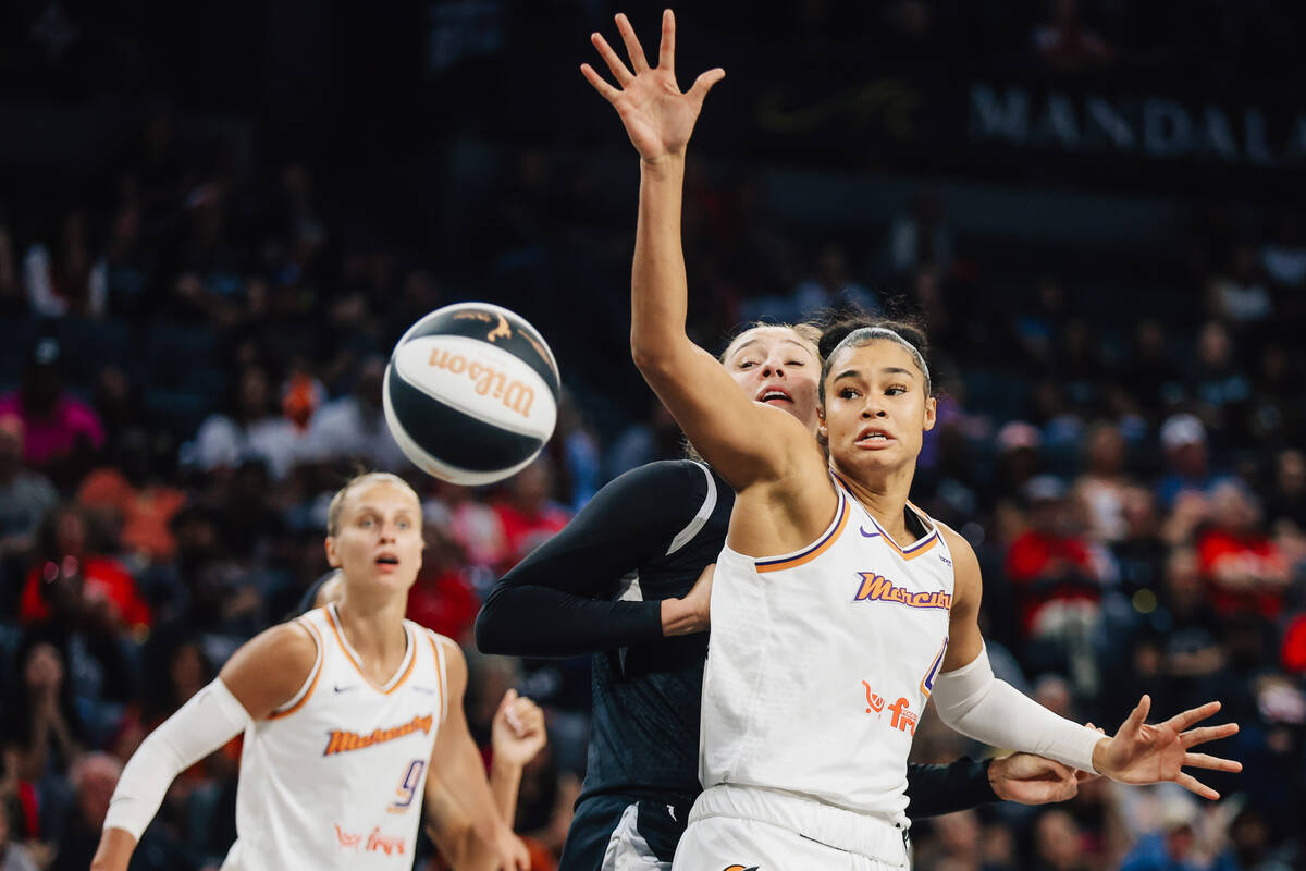 Phoenix Mercury forward Satou Sabally (0) reaches for the ball during a WNBA basketball game be ...