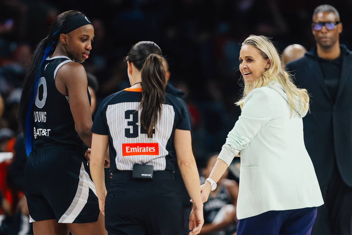 Aces head coach Becky Hammon looks back at a referee during a WNBA basketball game between the ...