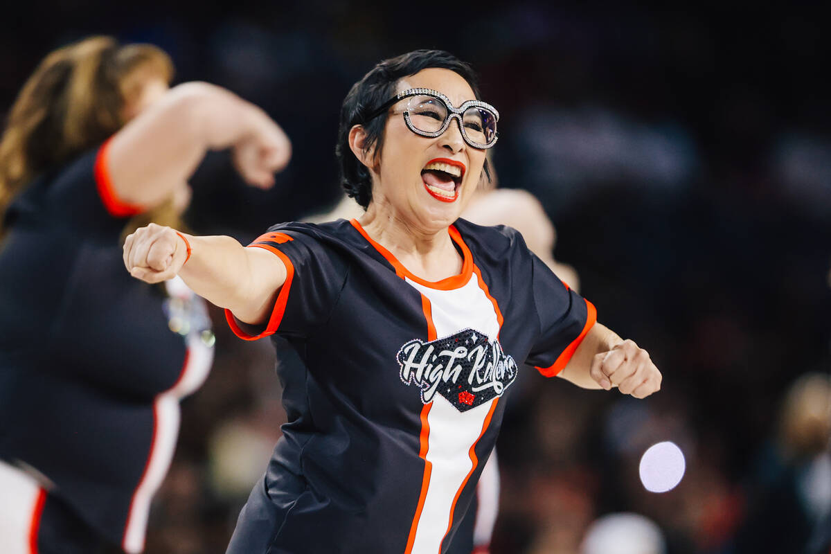 A member of the High Rollers dances during a WNBA basketball game between the Aces and Phoenix ...