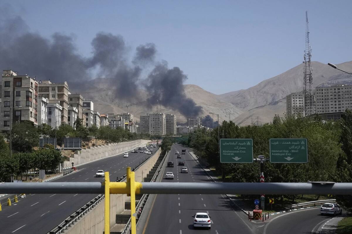 Smoke rises from an oil storage facility after it appeared to have been struck by an Israeli st ...