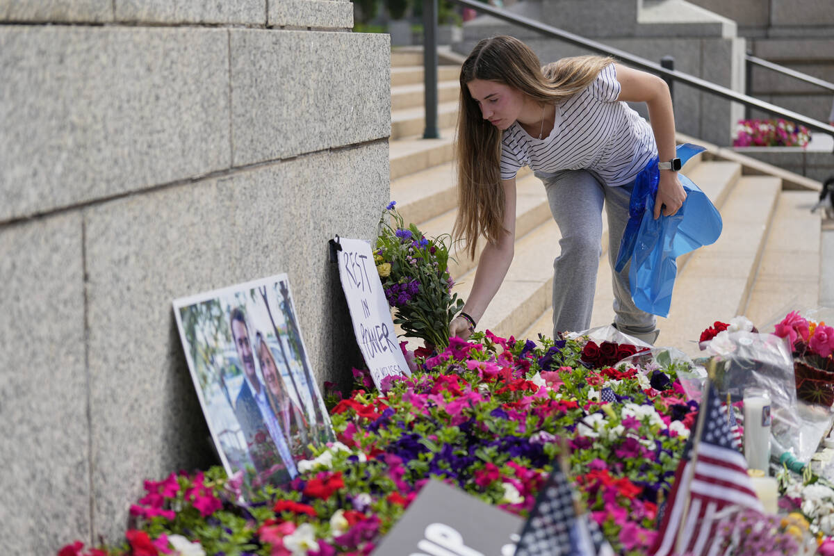 Claire Stein places flowers at a makeshift memorial for Minnesota state Rep. Melissa Hortman an ...